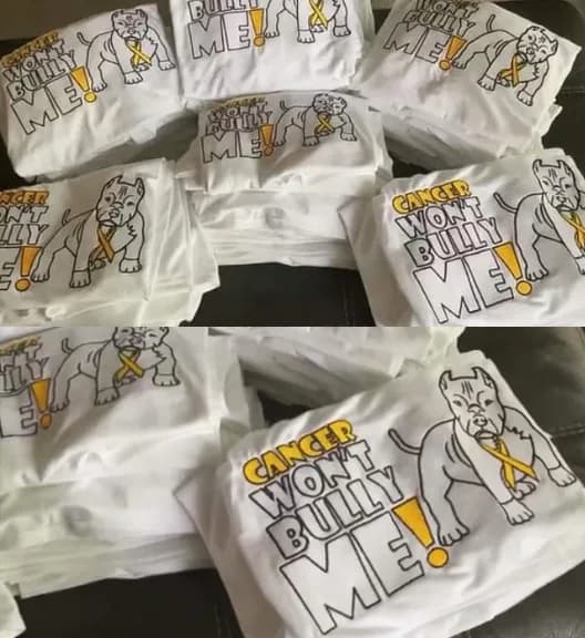 Cancer awareness artwork with yellow ribbons stitched on white garments