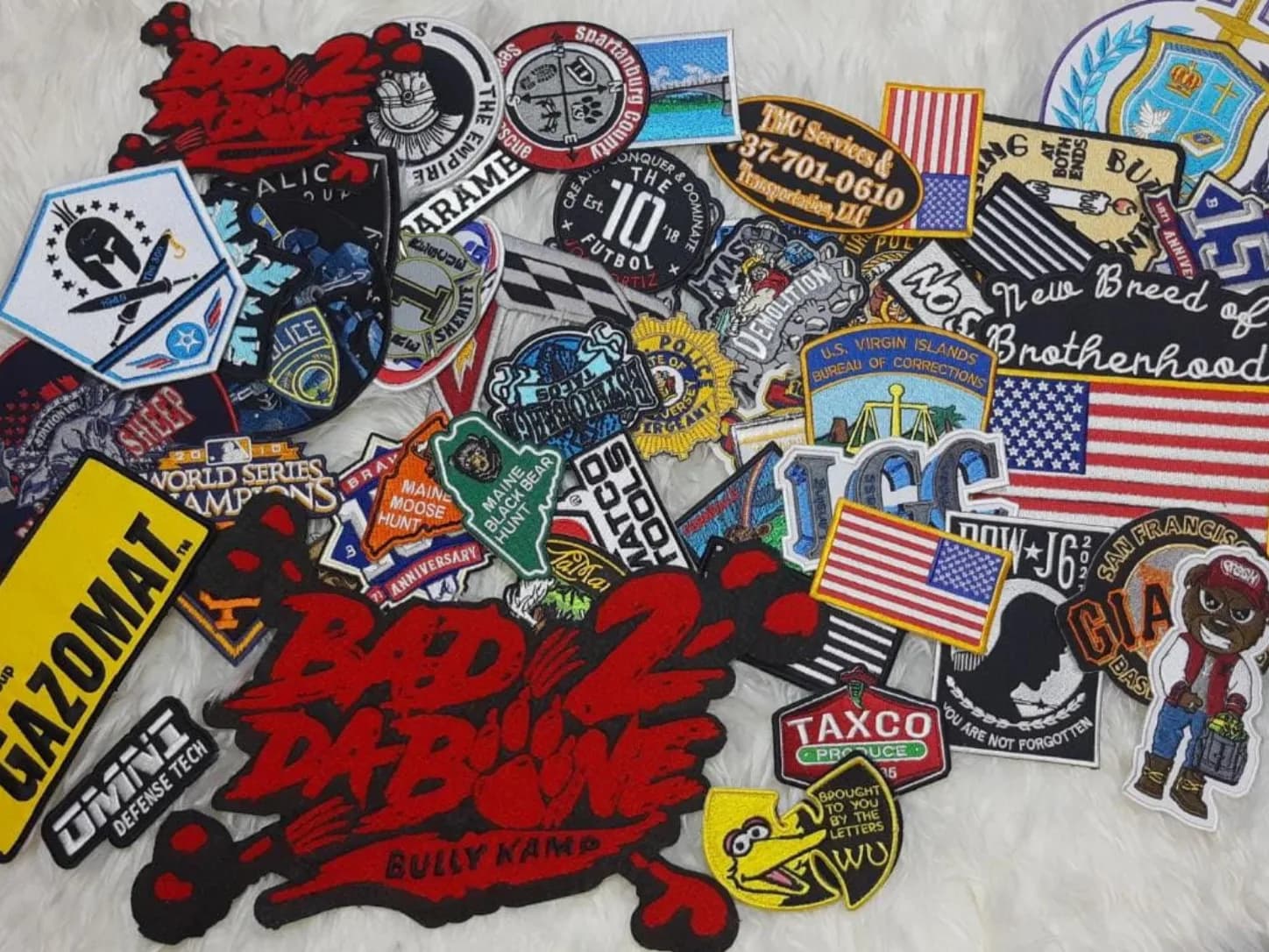 Assorted patches including red Bad to the Bone lettering